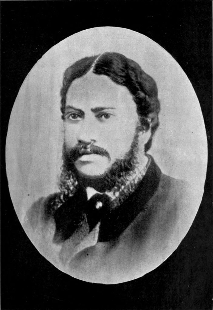 Oval portrait of Michael Madhusudan Dutt with long side-whiskers, in a dark coat