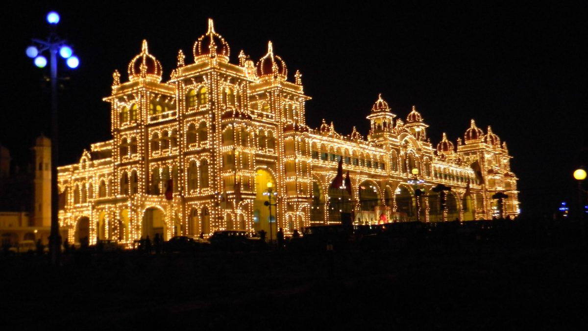 Mysore Palace lit up with thousands of lights at night during Dasara