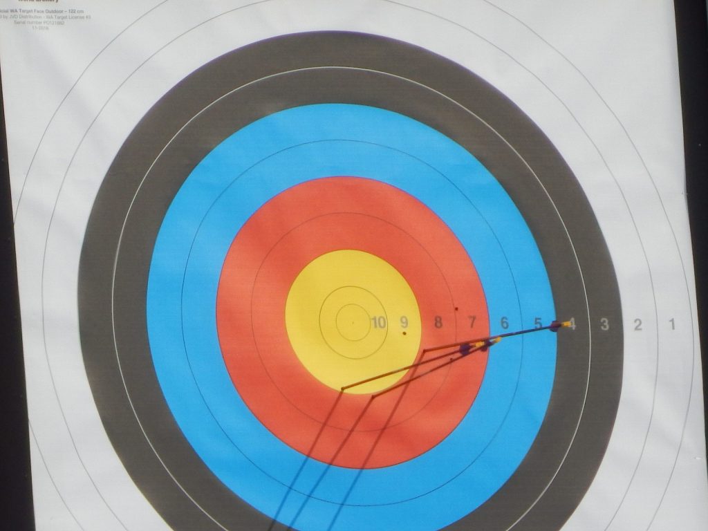 Arrows in the yellow centre of a recurve archery target