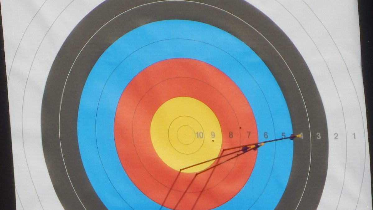 Arrows in the yellow centre of a recurve archery target