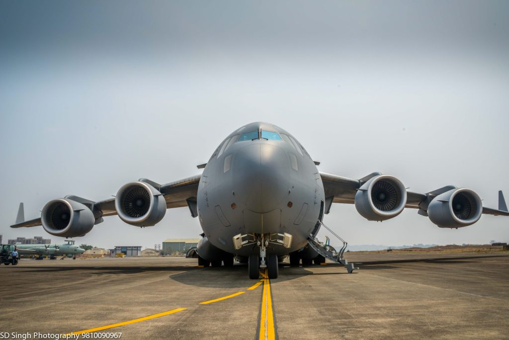 A grey Indian Air Force C-17 Globemaster transport aircraft seen head-on on a runway