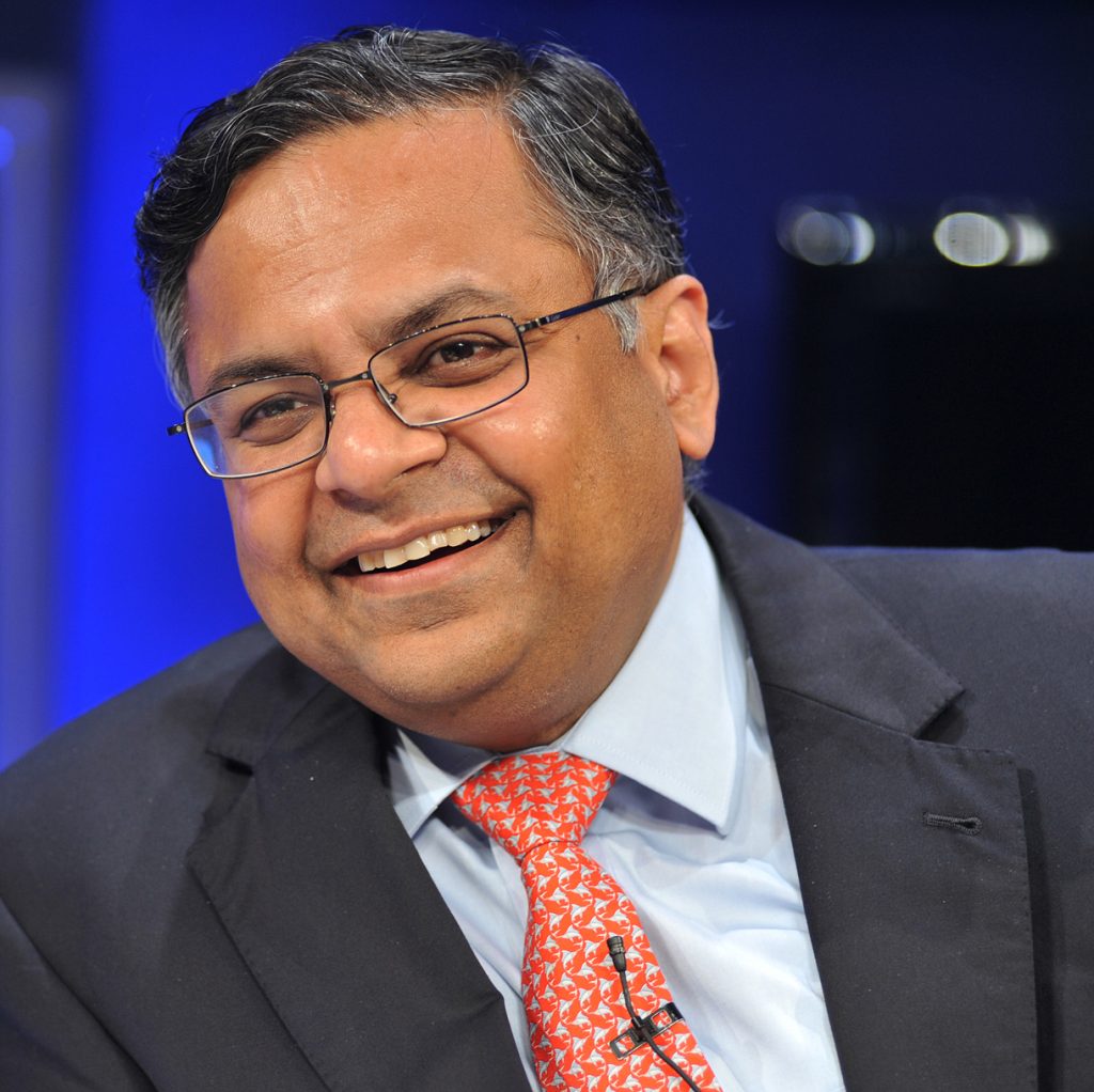N. Chandrasekaran in a suit and glasses speaking at a conference