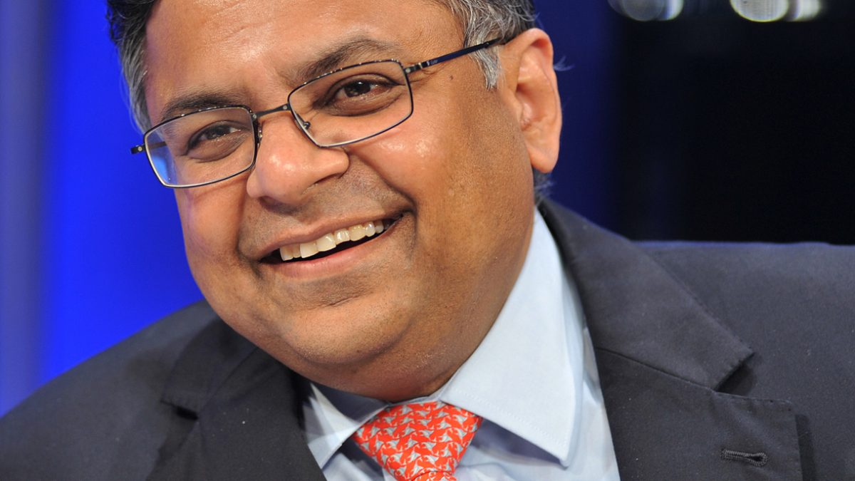 N. Chandrasekaran in a suit and glasses speaking at a conference