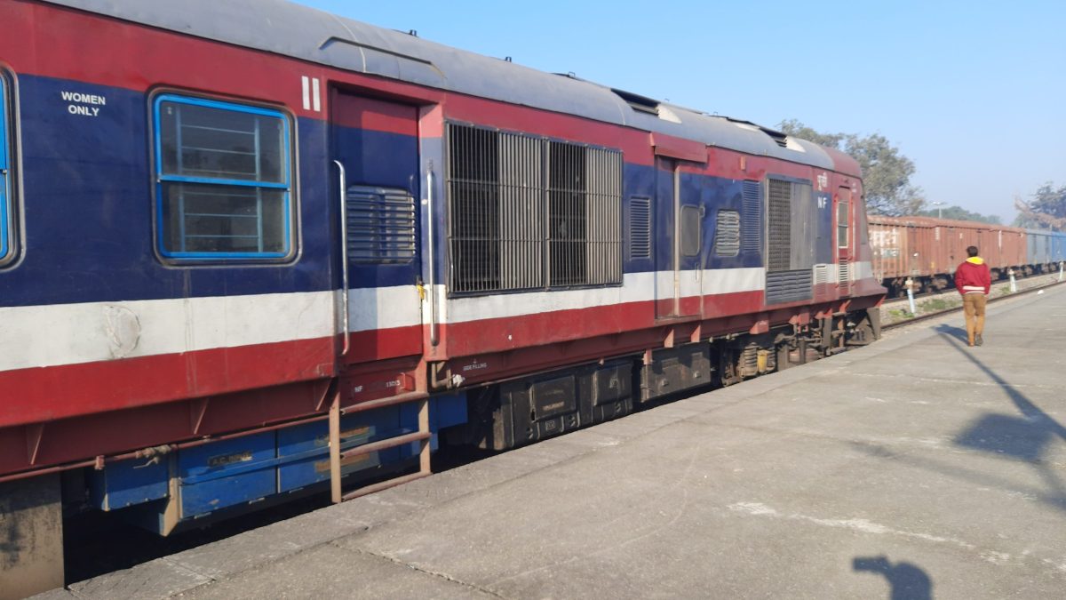 The driving power car of an Indian Railways DEMU train standing at a platform