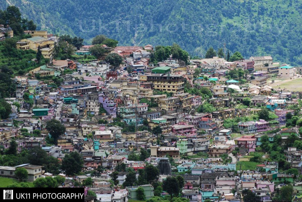 Houses of Gopeshwar town spread across a green Himalayan hillside in Chamoli district