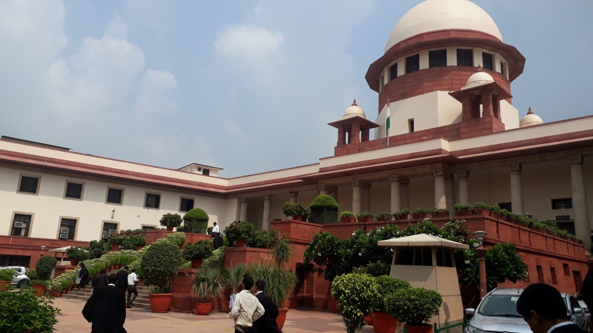 The domed main building of the Supreme Court of India seen across its lawn