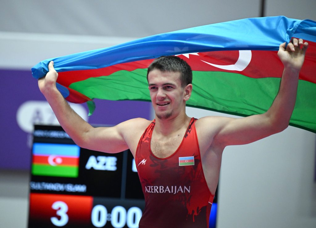 Two wrestlers in a Greco-Roman bout
