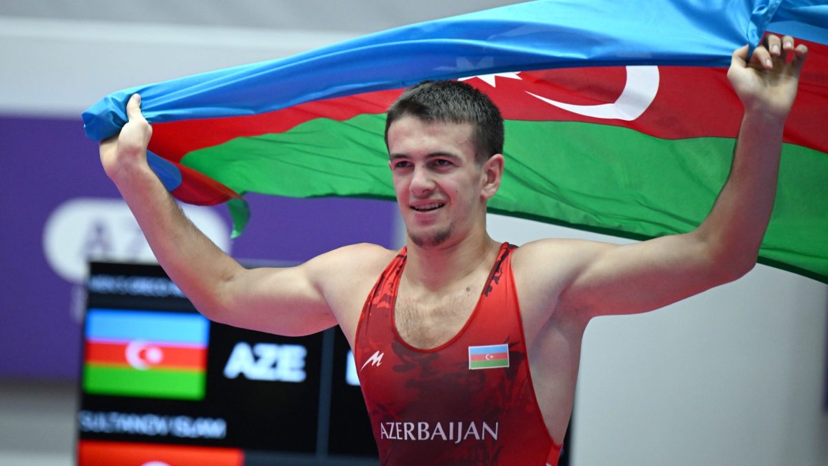 Two wrestlers in a Greco-Roman bout
