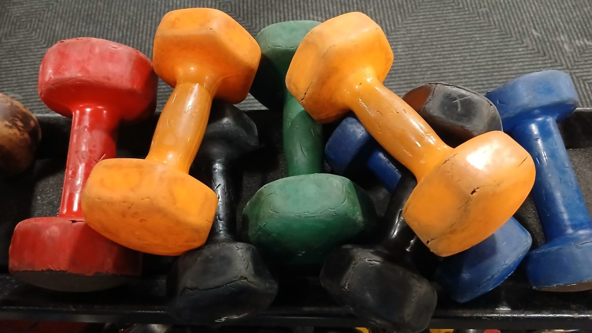 A pile of dumbbells at a gym