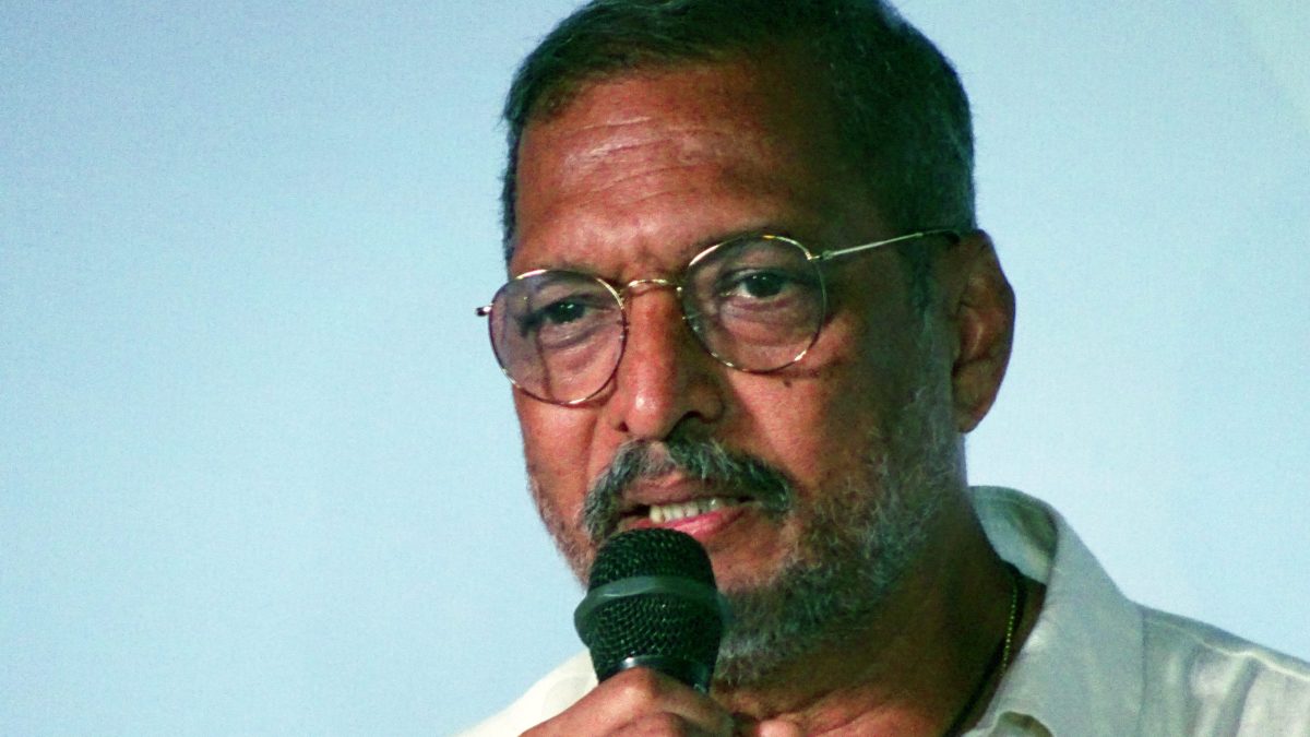 Nana Patekar speaking into a microphone