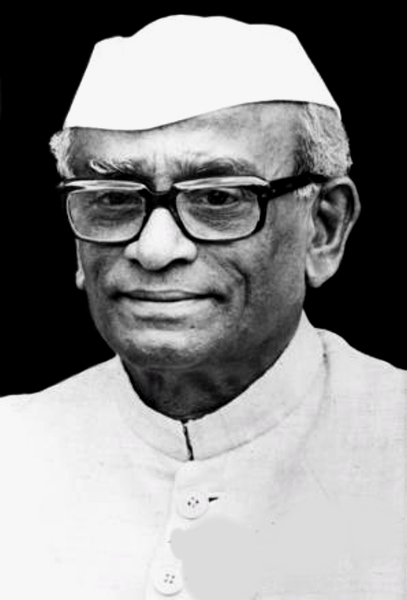 A black-and-white portrait of Neelam Sanjiva Reddy in a white cap and glasses