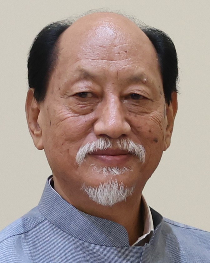 Neiphiu Rio with a white goatee, in a grey bandhgala