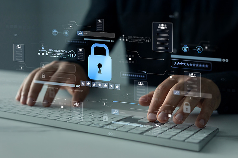 Hands typing on a keyboard with a glowing padlock and data protection icons floating above the screen