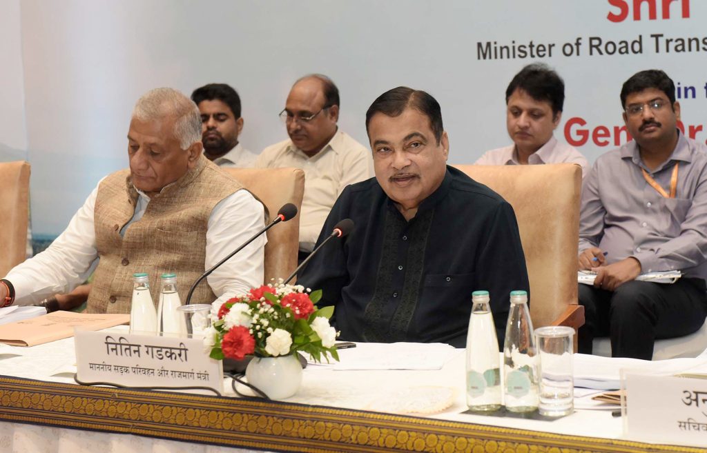 Nitin Gadkari speaking at a ministry meeting with General V. K. Singh beside him