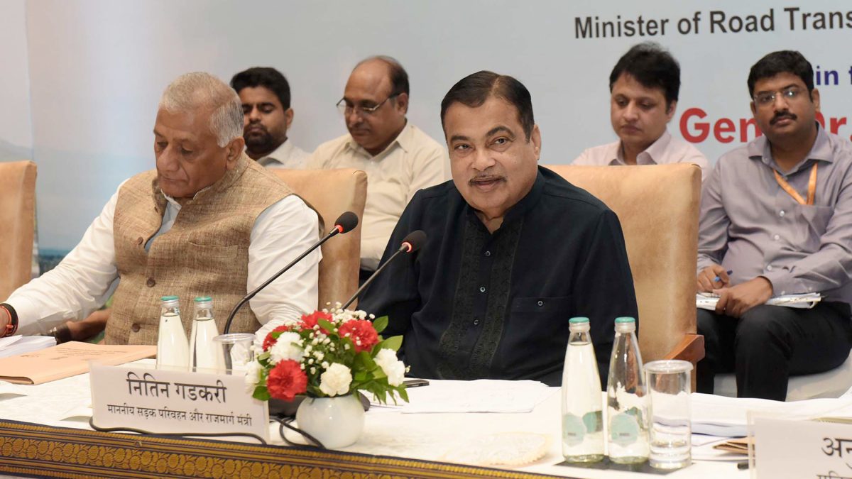 Nitin Gadkari speaking at a ministry meeting with General V. K. Singh beside him