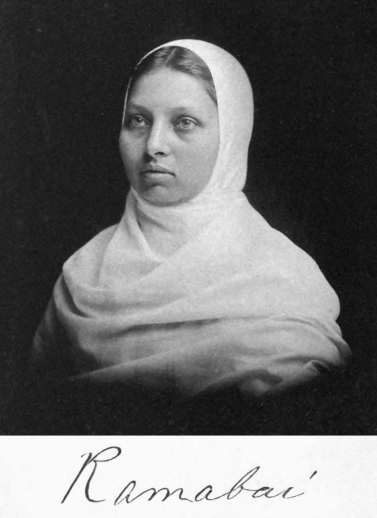 Black-and-white portrait of Pandita Ramabai with a white shawl over her head and her signature below