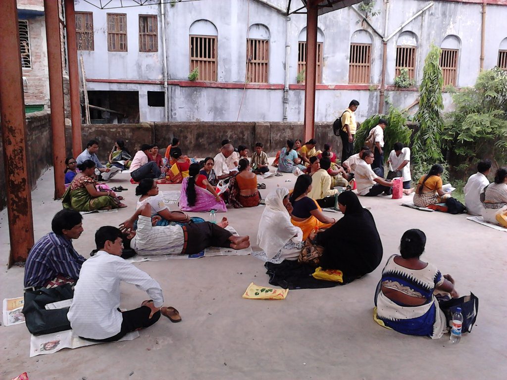 Candidates seated on the ground outside an entrance examination centre in Howrah
