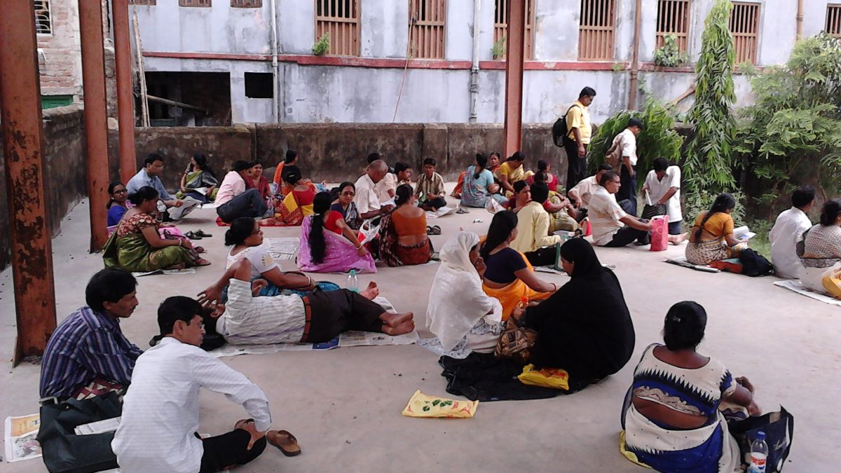 Candidates seated on the ground outside an entrance examination centre in Howrah