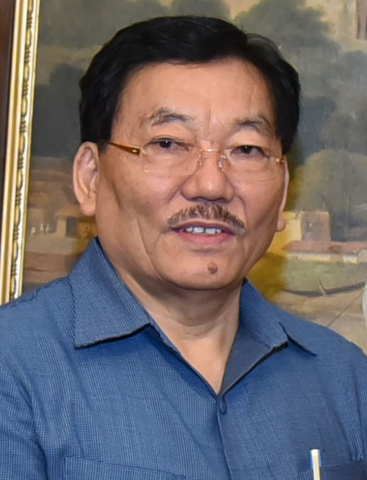 Pawan Kumar Chamling in glasses and a blue shirt