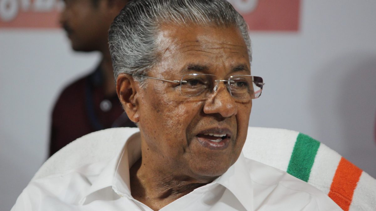 Close-up of Pinarayi Vijayan in glasses and a white shirt, speaking