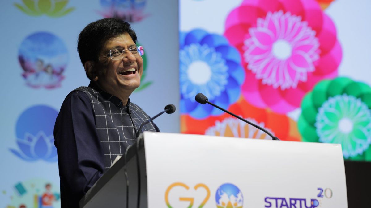 Union Commerce Minister Piyush Goyal speaking at a podium during the G20 Startup20 summit in Gurugram
