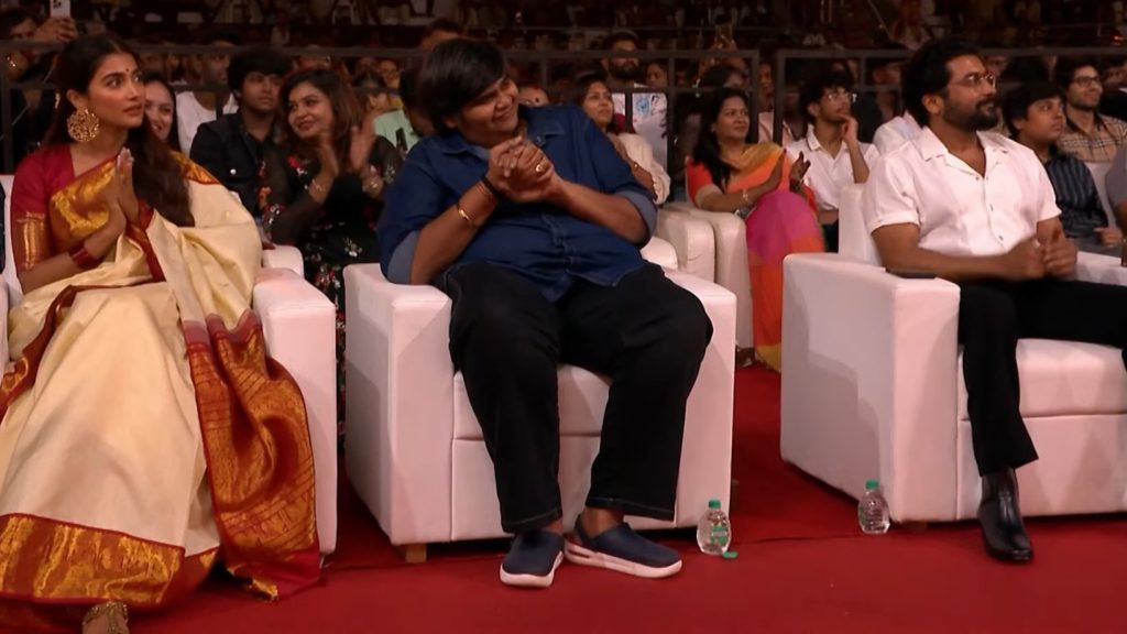Pooja Hegde with Suriya and Karthik Subbaraj at the audio launch of the film Retro