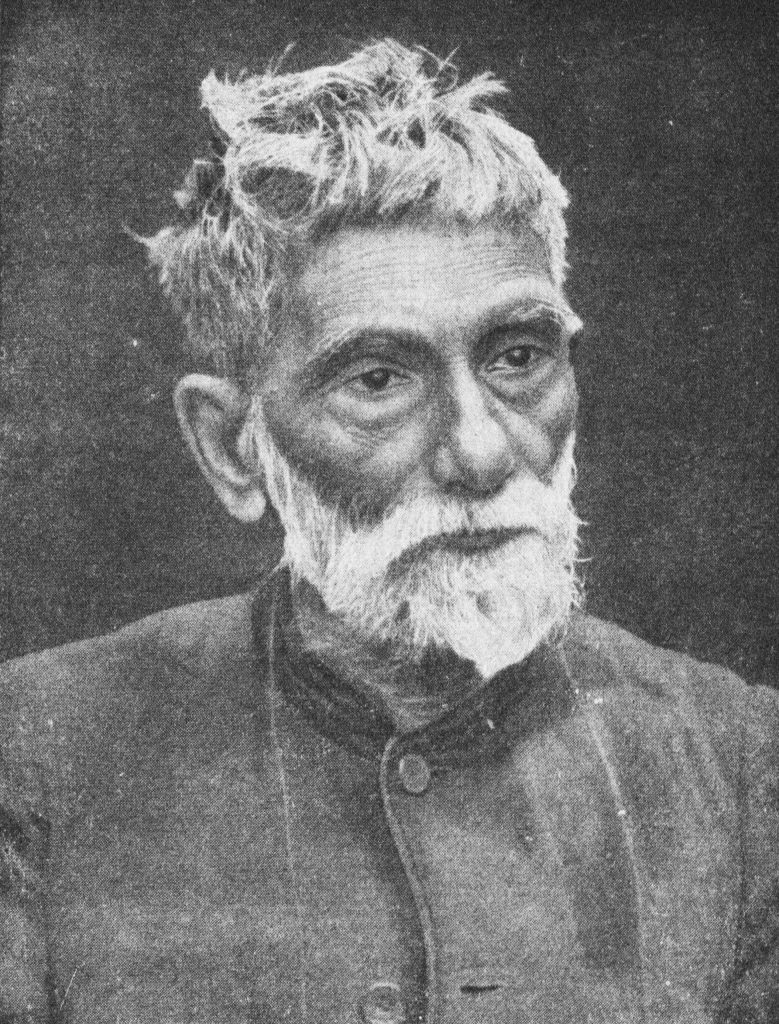 Black-and-white portrait of an elderly Prafulla Chandra Ray with white hair and beard