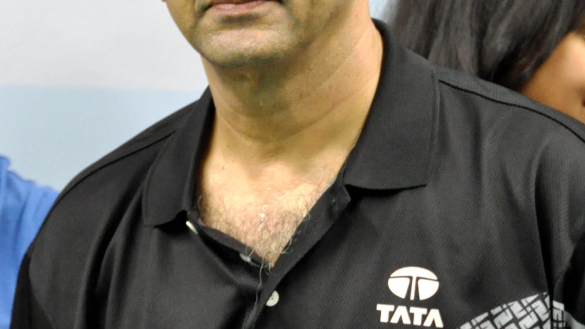 Prakash Padukone in a blazer at a badminton tournament