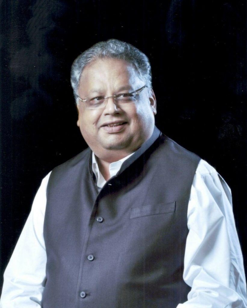 A portrait of Rakesh Jhunjhunwala in a white shirt