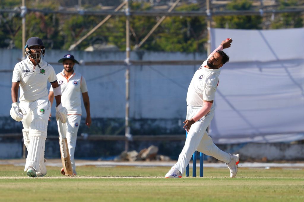 A bowler in his delivery stride during a Ranji Trophy match