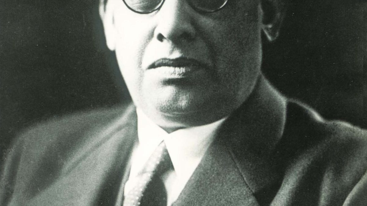 Rash Behari Bose in round glasses, a suit and tie