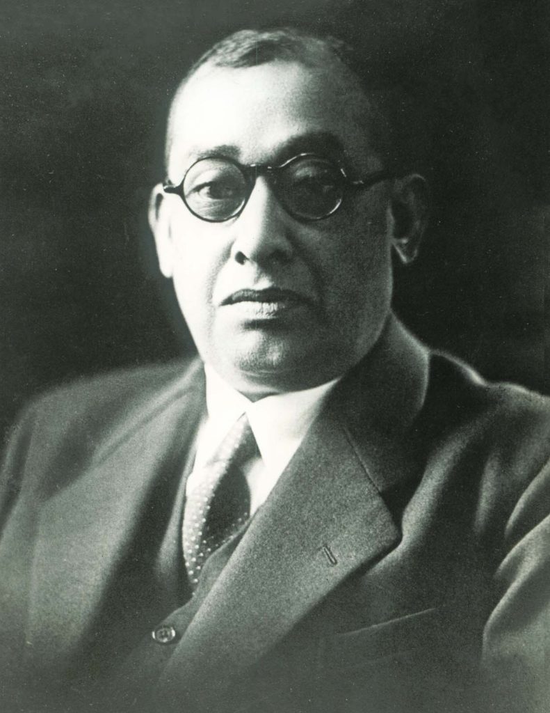 Rash Behari Bose in round glasses, a suit and tie