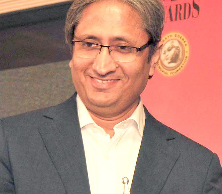 Ravish Kumar in a jacket at an awards ceremony