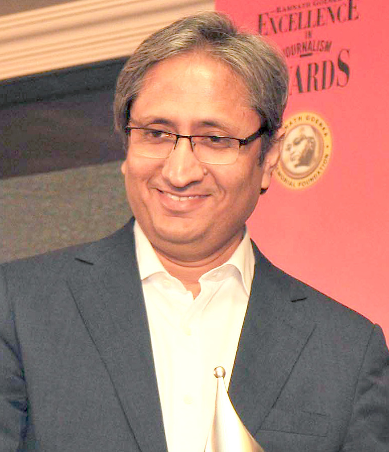 Ravish Kumar in a jacket at an awards ceremony