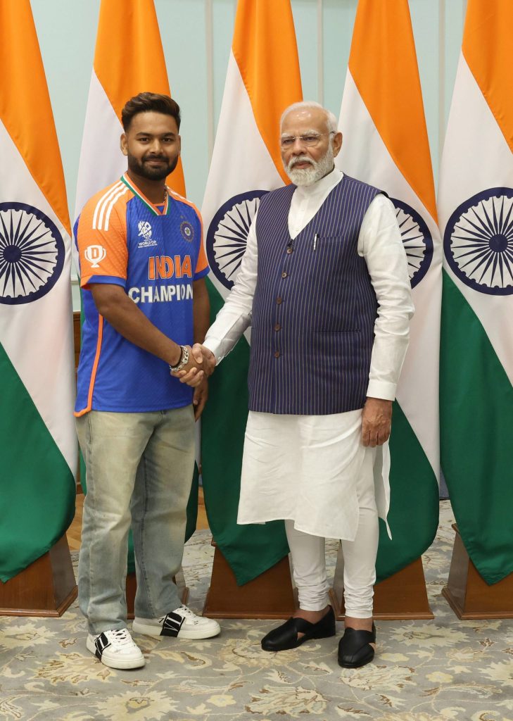 Rishabh Pant in India's champions jersey with Prime Minister Narendra Modi