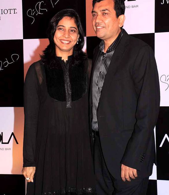 Sanjeev Kapoor in a suit at a restaurant launch