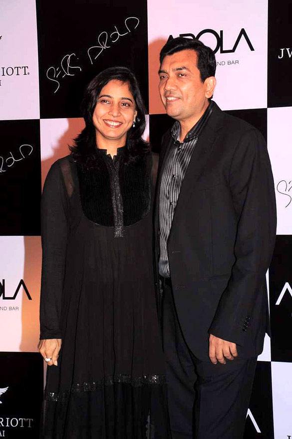 Sanjeev Kapoor in a suit at a restaurant launch