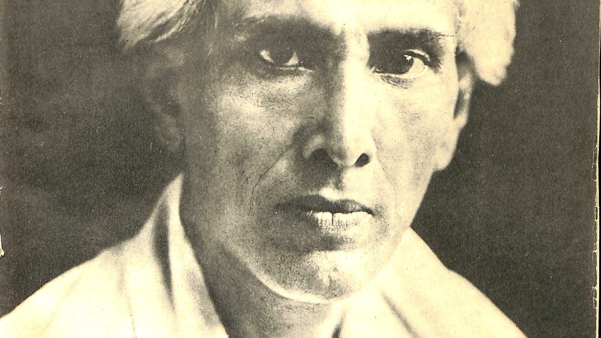 Portrait of Sarat Chandra Chattopadhyay with white hair, in a white kurta and shawl