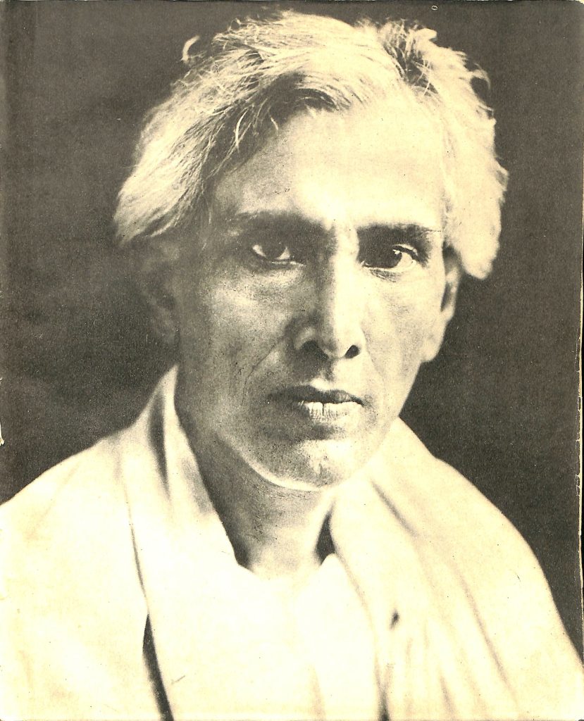 Portrait of Sarat Chandra Chattopadhyay with white hair, in a white kurta and shawl