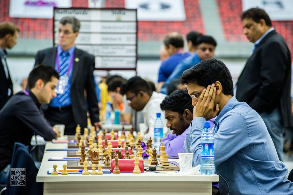 Indian chess players seated at their boards during a Chess Olympiad