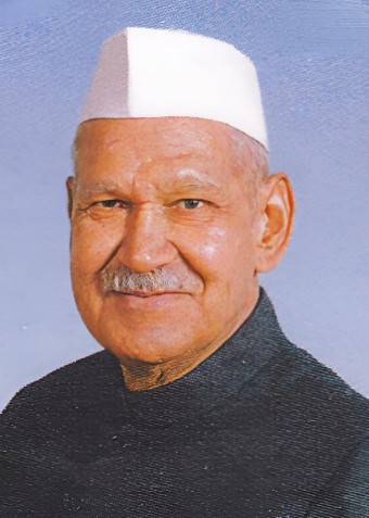 Shankar Dayal Sharma in a white cap and dark achkan