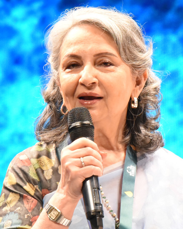 Sharmila Tagore speaking into a microphone