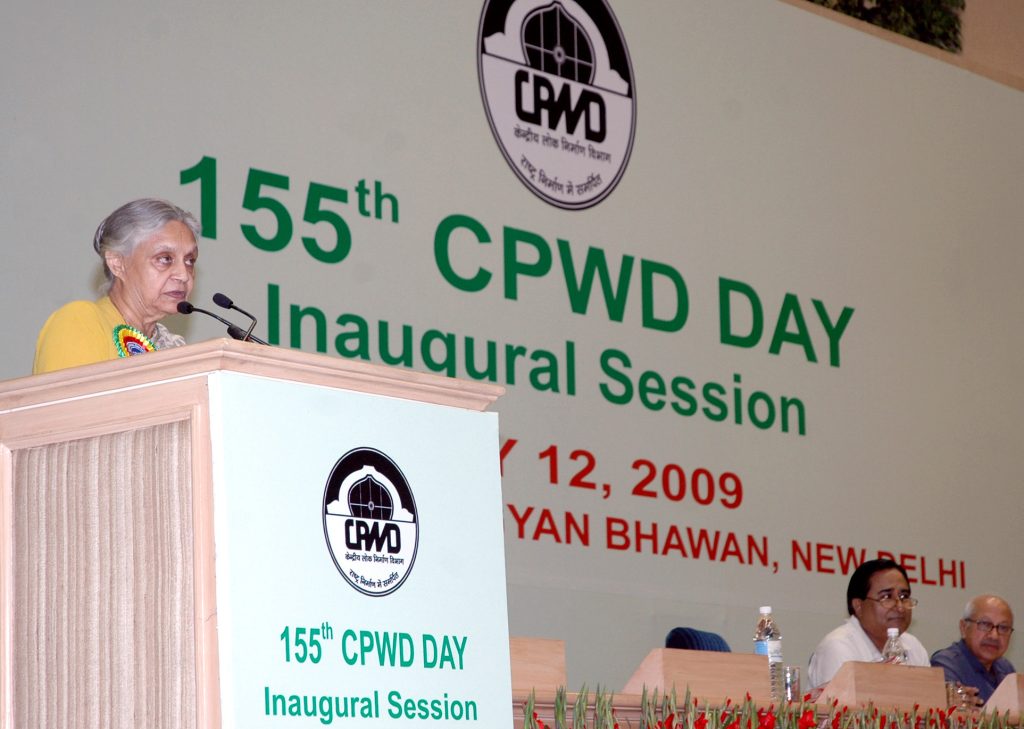 Sheila Dikshit with white hair speaking at a lectern at a CPWD Day event