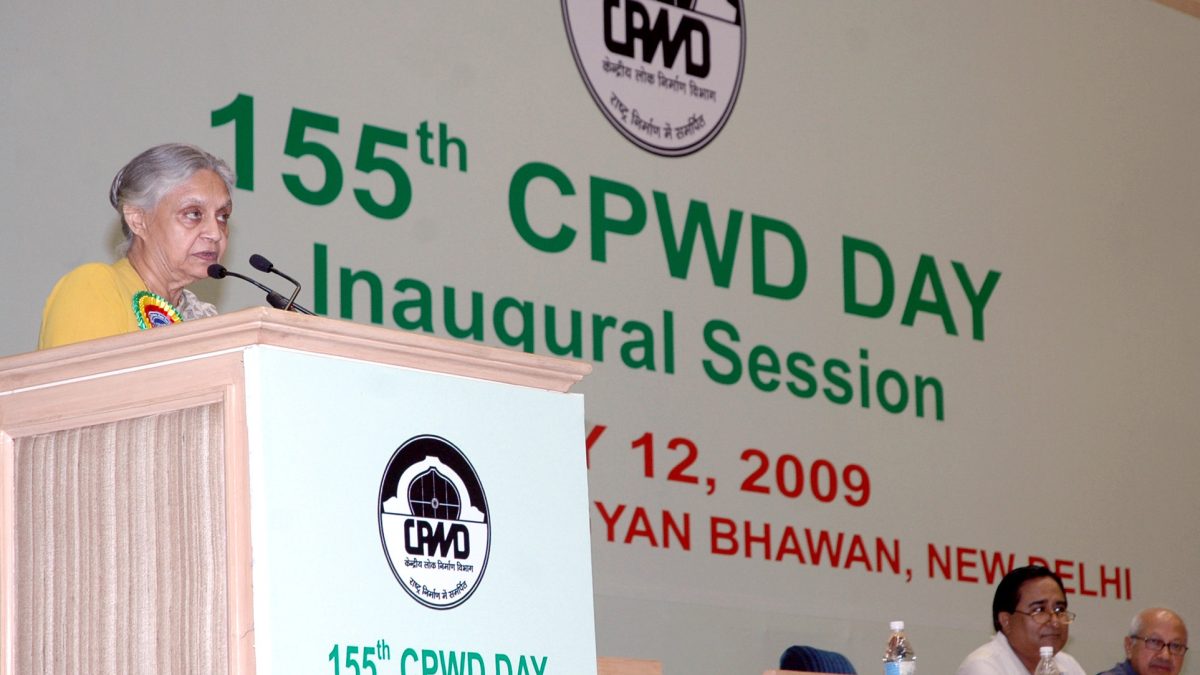 Sheila Dikshit with white hair speaking at a lectern at a CPWD Day event