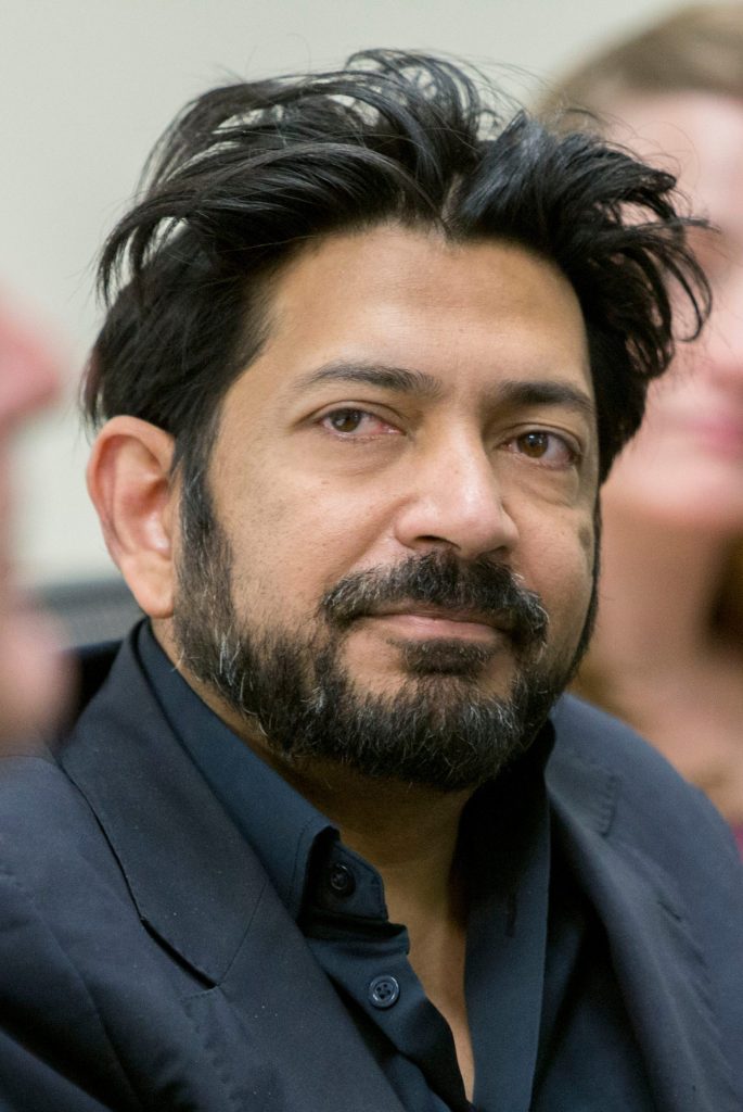 Siddhartha Mukherjee speaking at a lectern