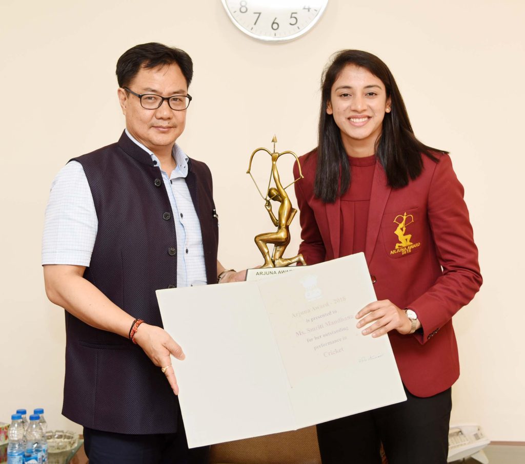 Smriti Mandhana receiving the Arjuna Award from sports minister Kiren Rijiju