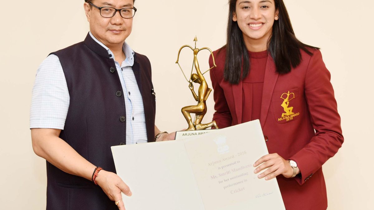 Smriti Mandhana receiving the Arjuna Award from sports minister Kiren Rijiju