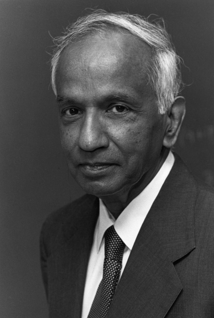Black-and-white portrait of Subrahmanyan Chandrasekhar in a suit and tie