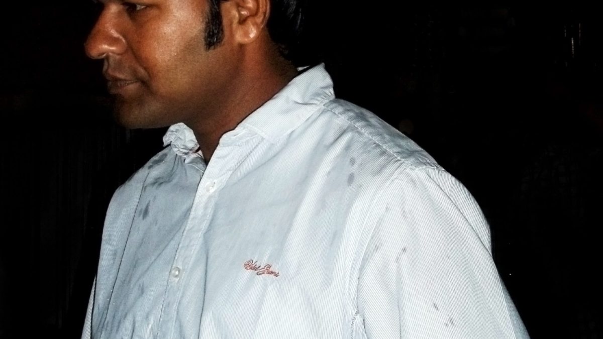 Sudarsan Pattnaik in a white shirt at an evening event
