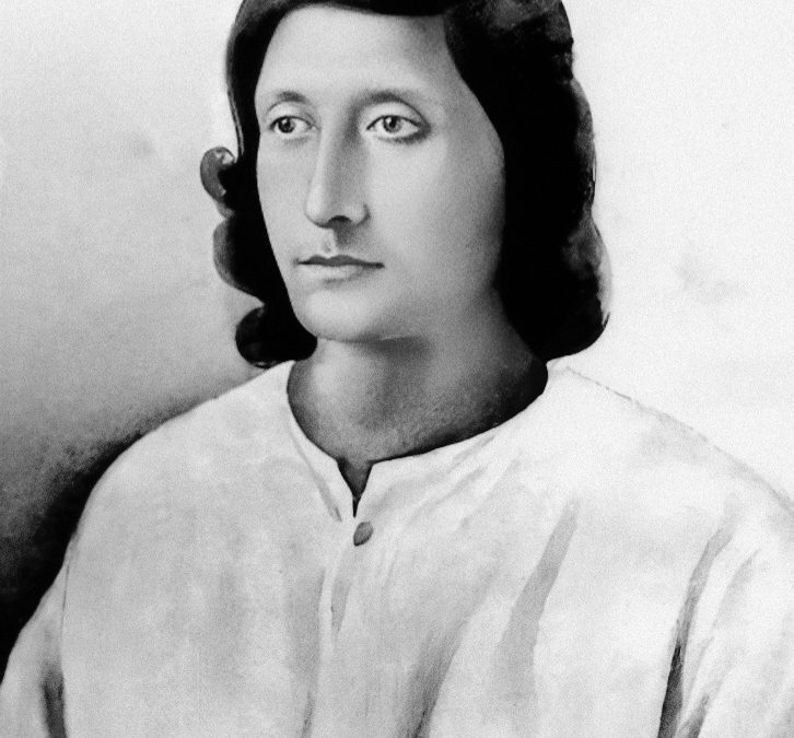 Portrait of a young Nirala with shoulder-length hair, in a white kurta